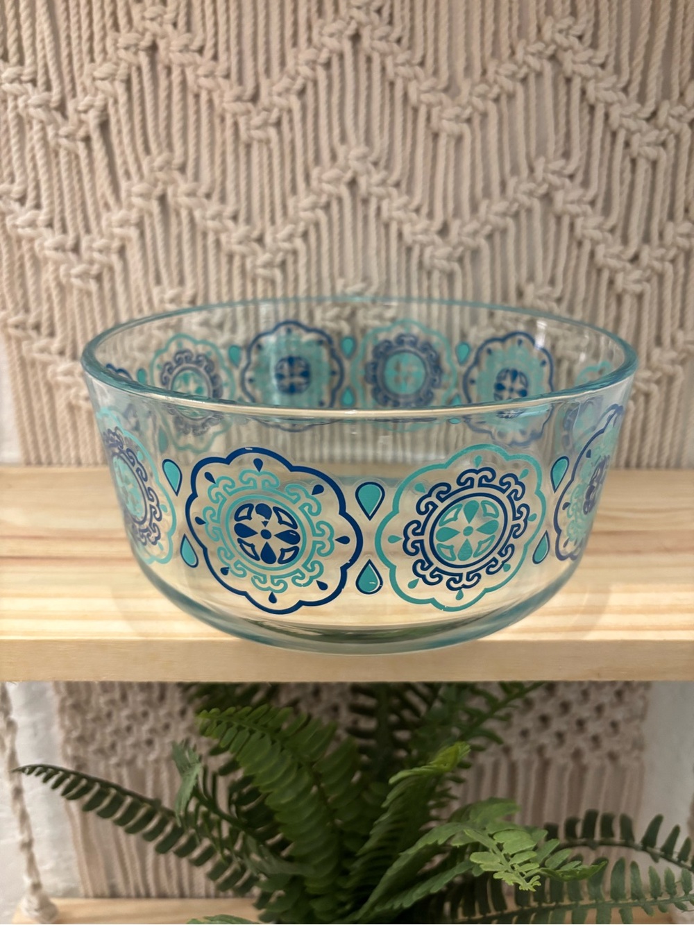 Vintage Pyrex clear glass mixing bowl featuring a retro blue and turquoise